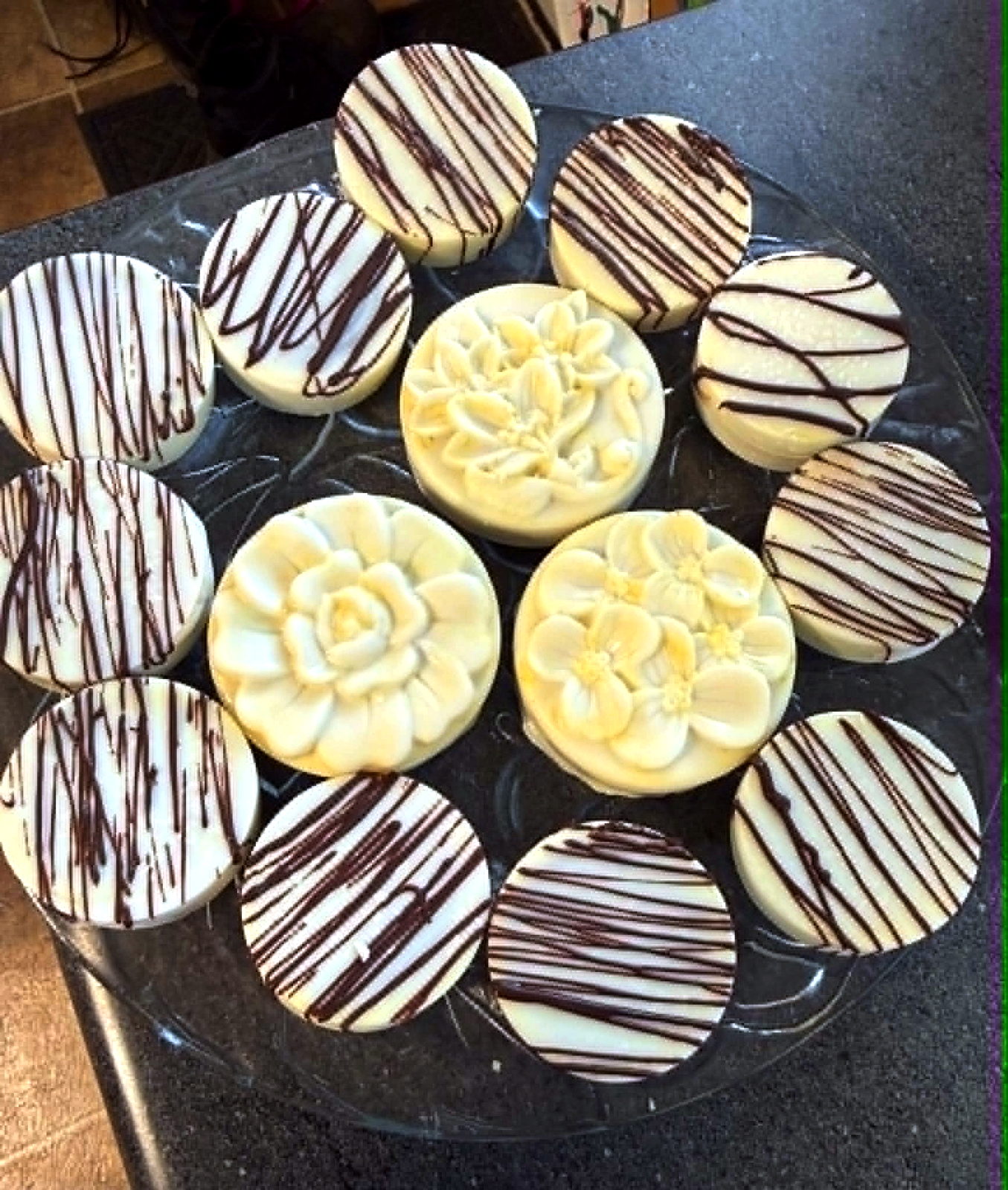 White chocolate dipped Oreos with chocolate drizzle and molded flowers